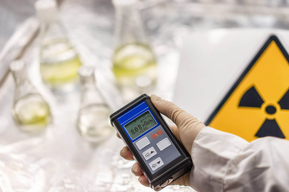 the scientist measures the level of radiation